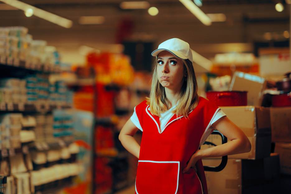 Woman working in grocery store late - Overtime Violations